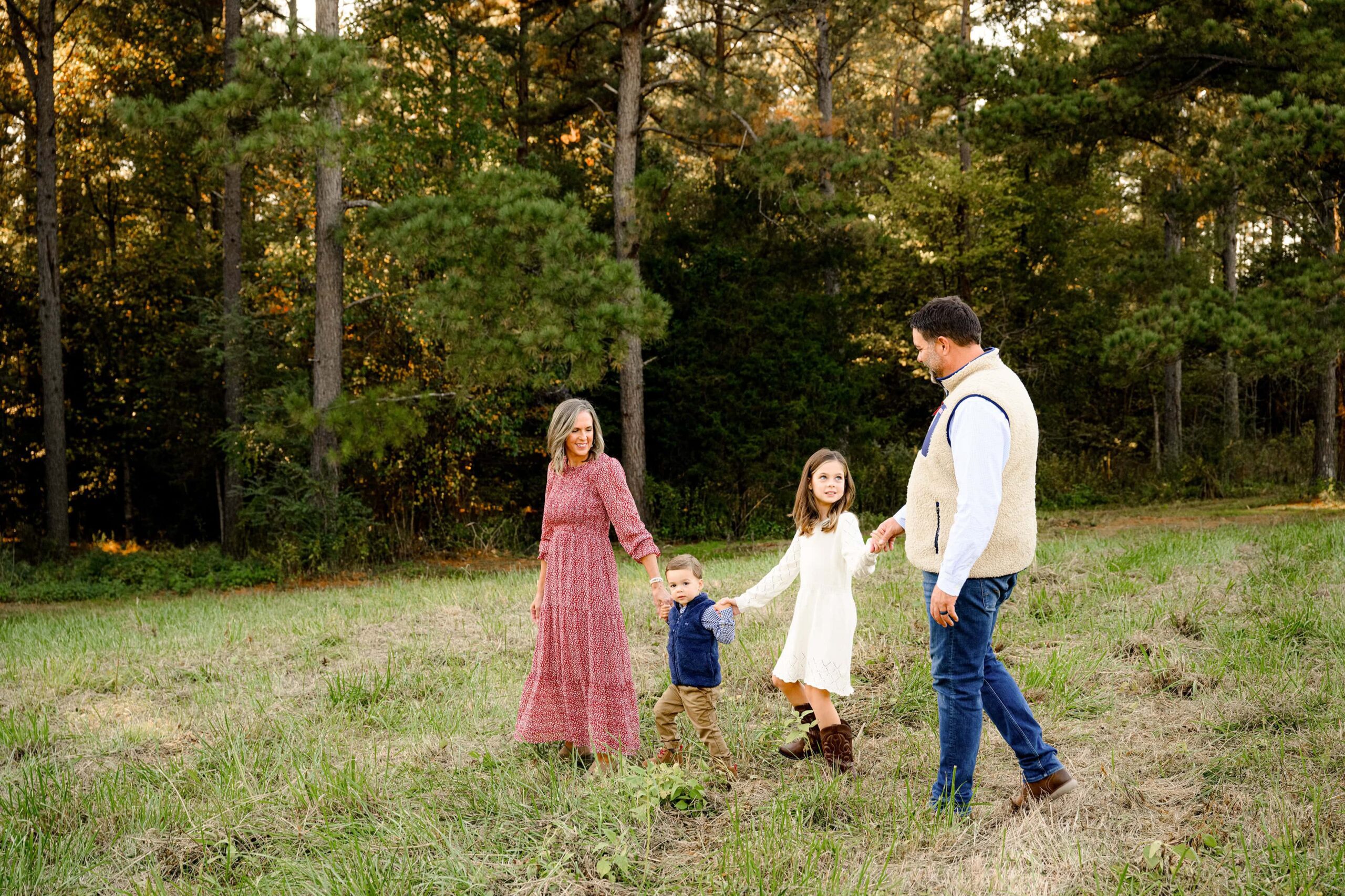 Family of Four walking hand in hand during a fall family mini session