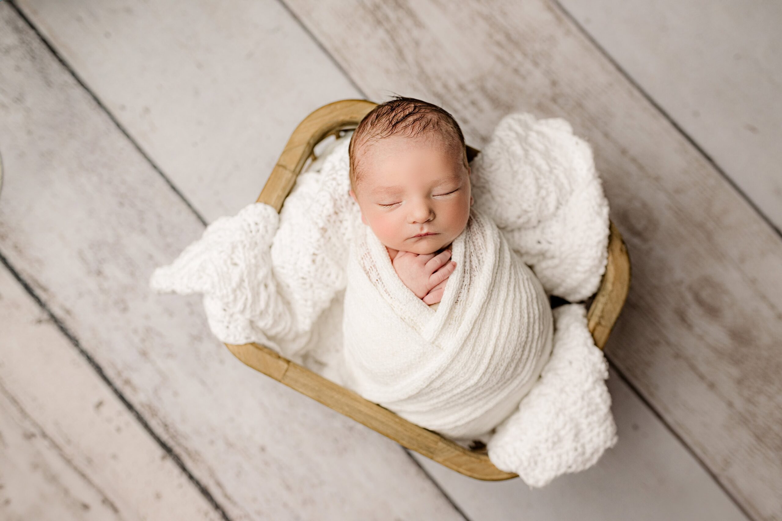 overhead images of a little newborn boy during his lifestyle session in his indian land sc home