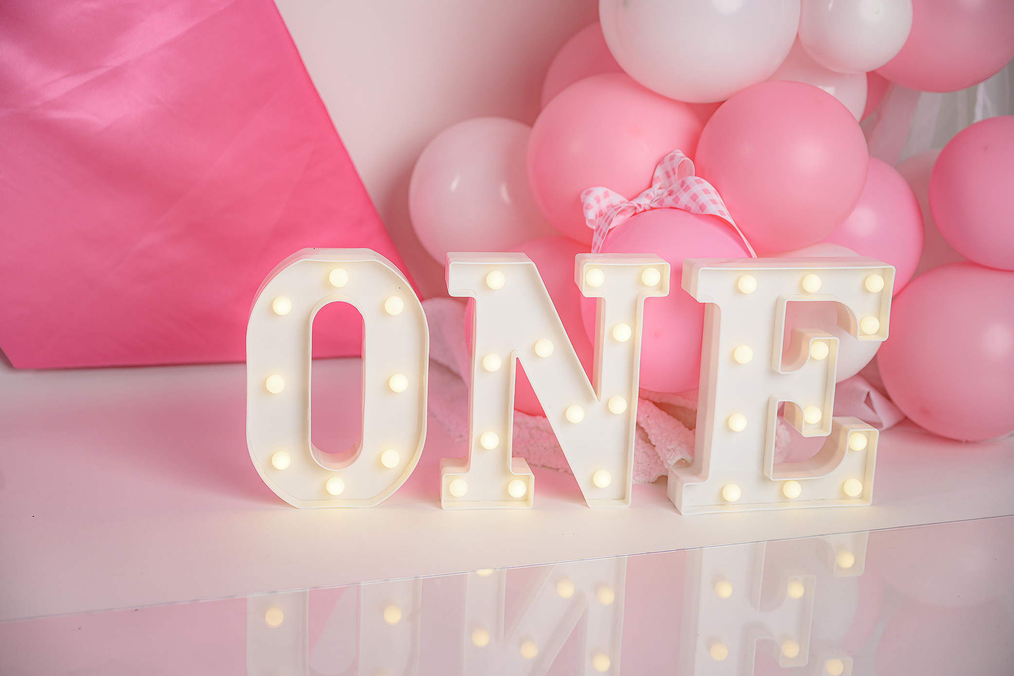 Marquee ONE letters in a cake smash set up in a waxhaw, nc studio one-year-old-photo session