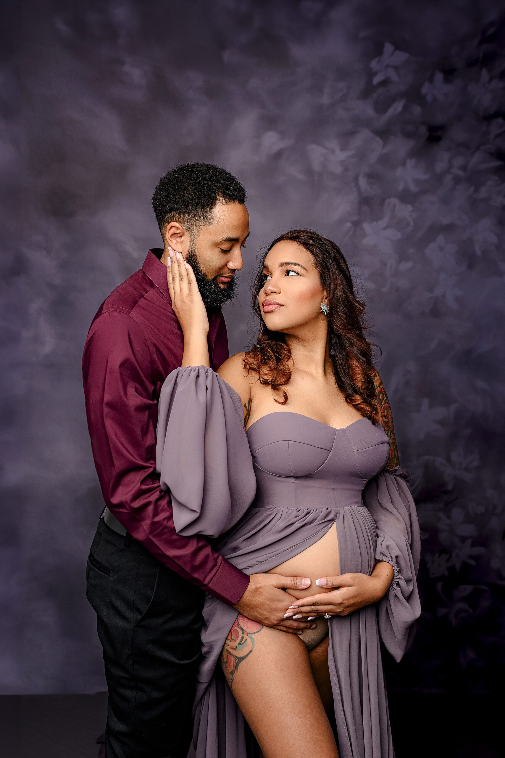 Charlotte, NC couple posed together  relaxing in anticipation of meeting their new baby boy and showing all the excitement of becoming parents during their waxhaw nc studio session