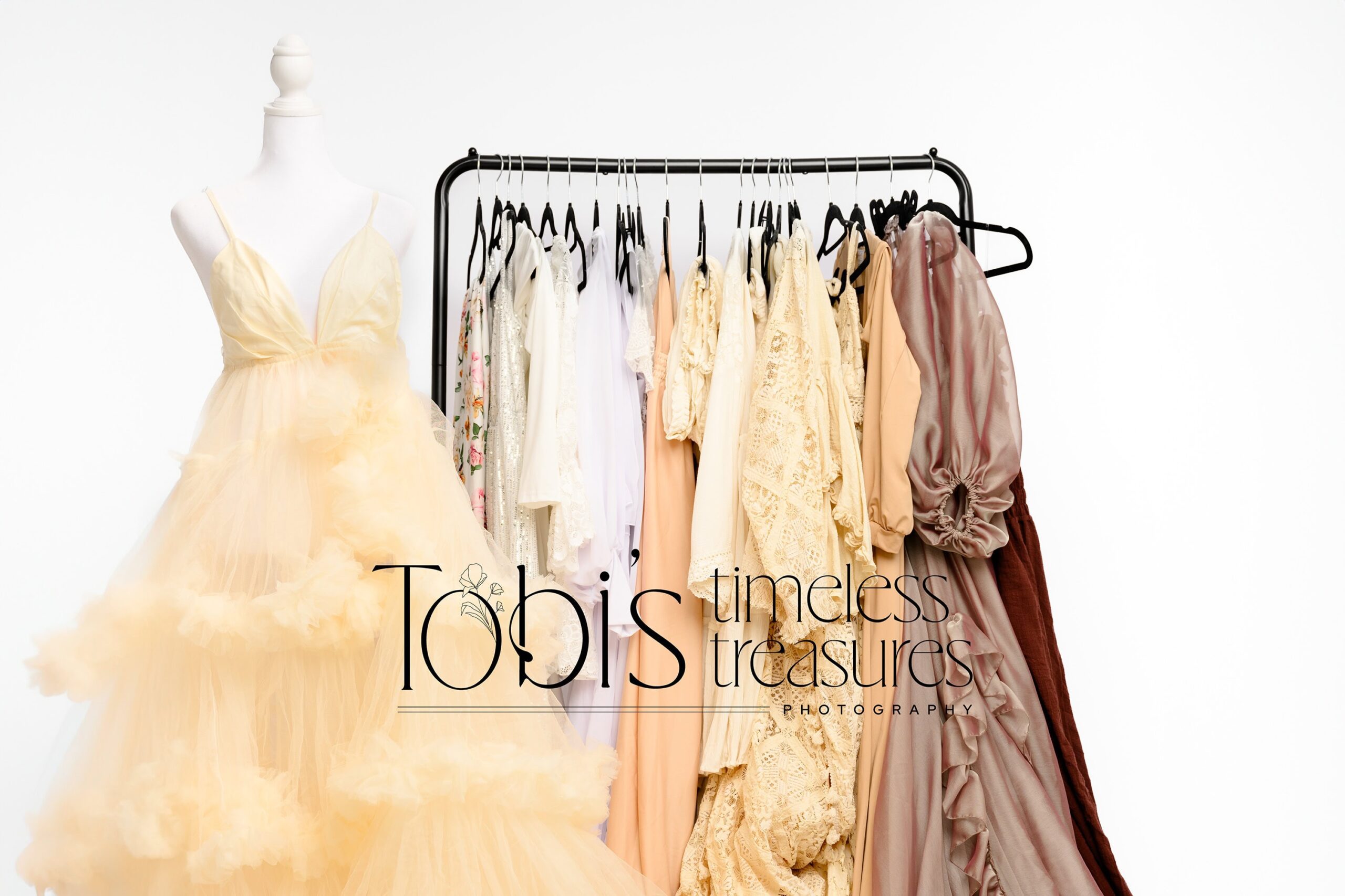 photo of all the neutral dresses from the maternity client closet available to all charlotte, nc maternity clients