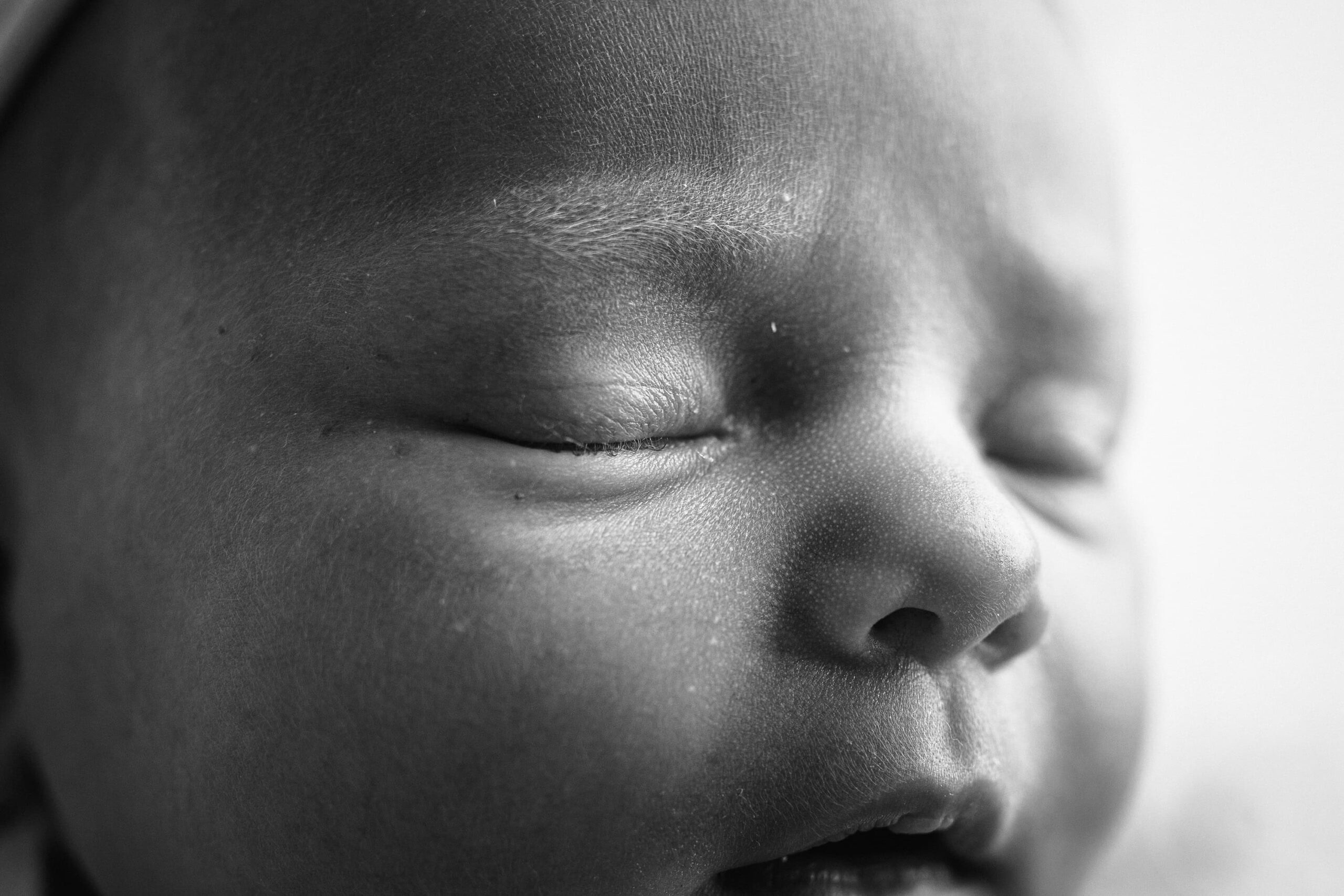 black and white baby girl isla detail photos of eyelashes