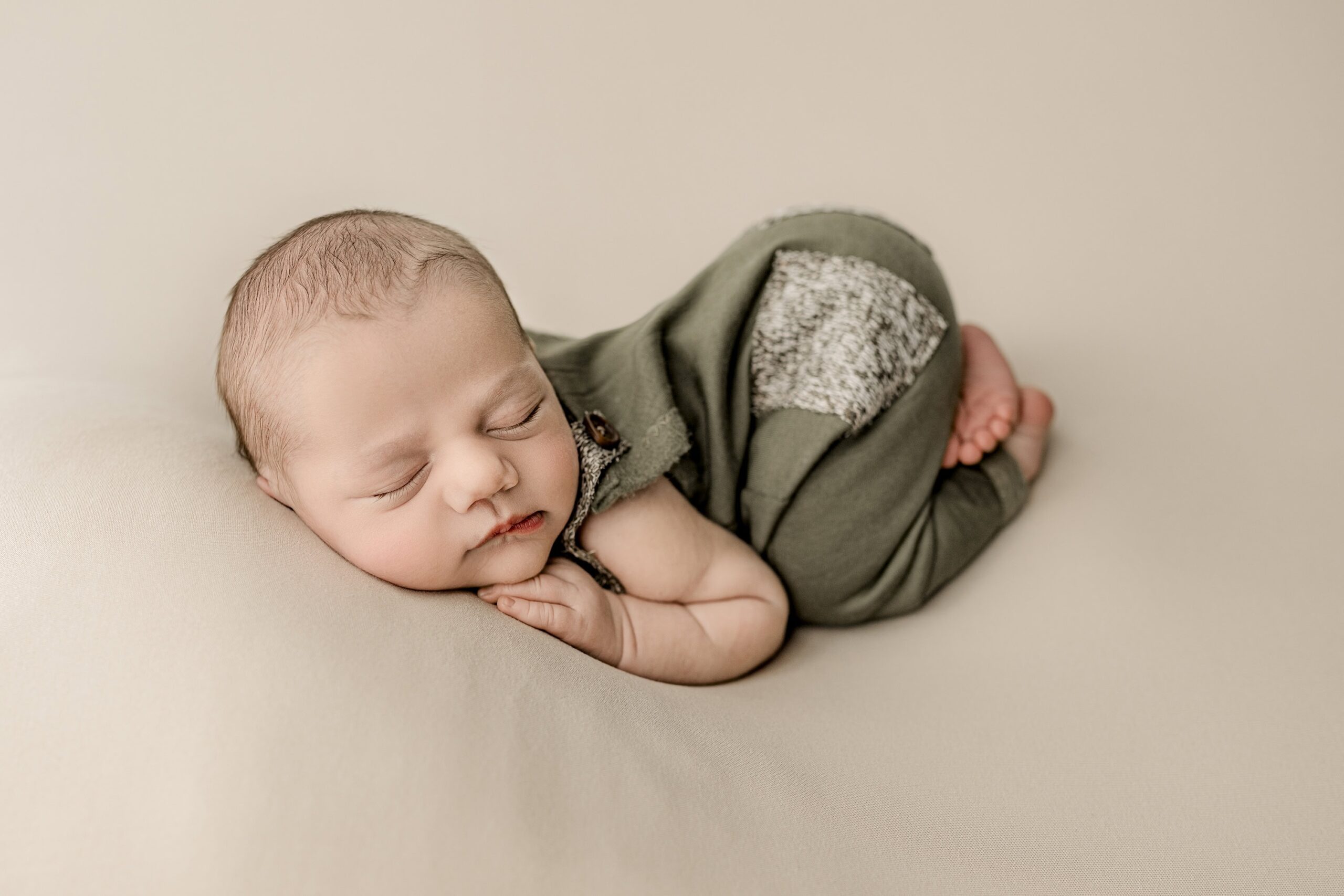 newborn baby boy posed with bum in the air