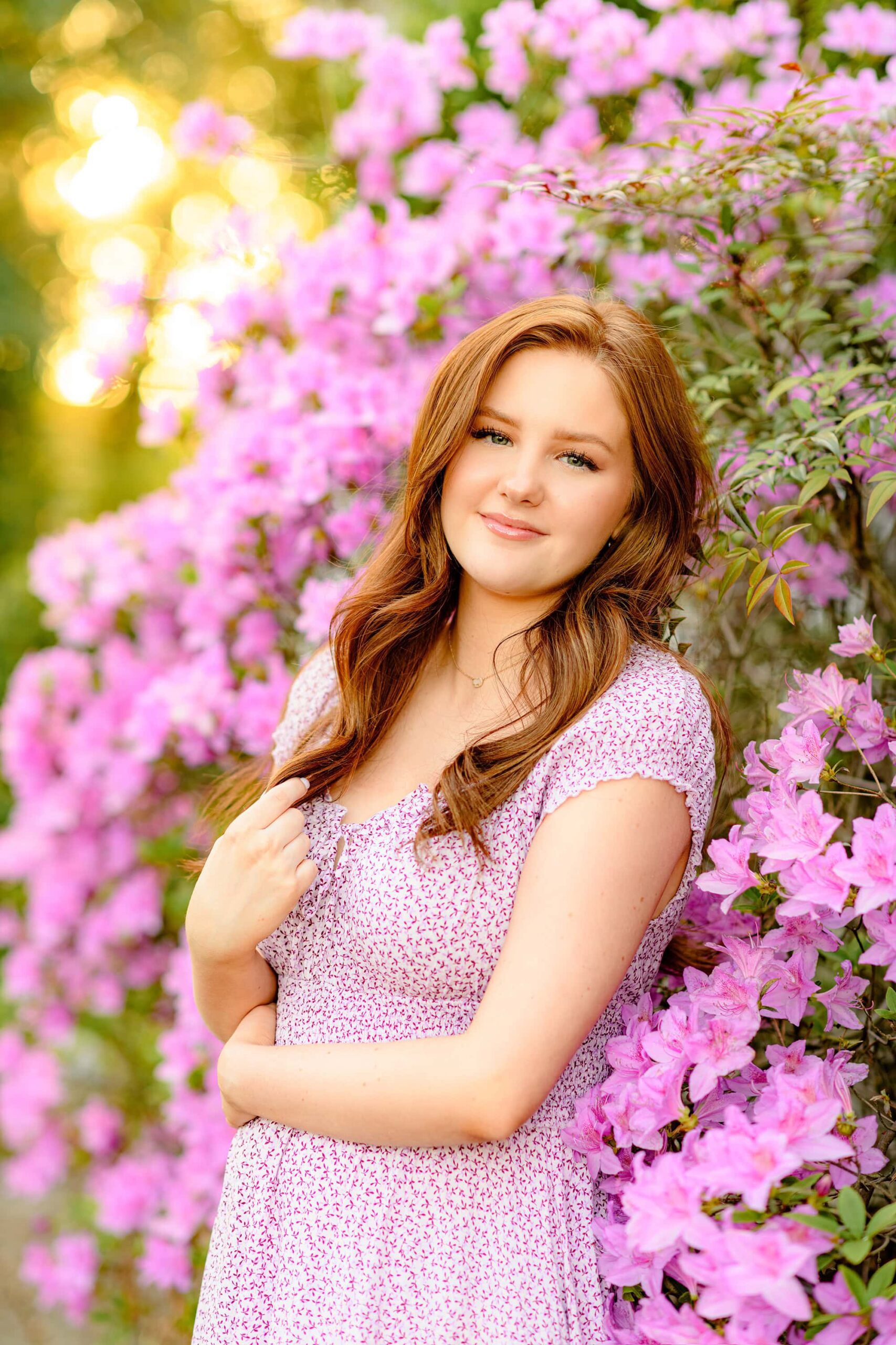 Glencairn gardens in rock hill, sc floral backdrop with a senior girl with red hair wearing a purple dress