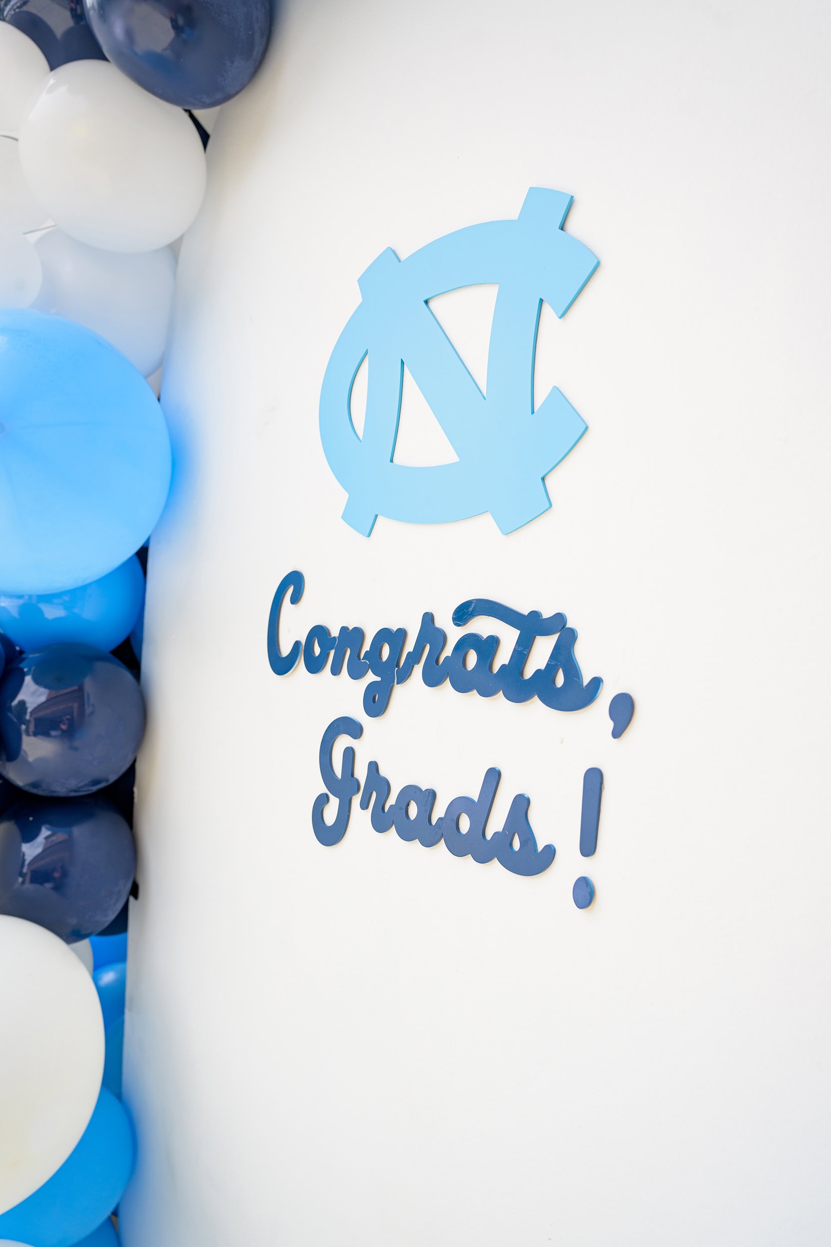 logo for UNC Chapel Hil and congrats grad sign for a high school graduation party