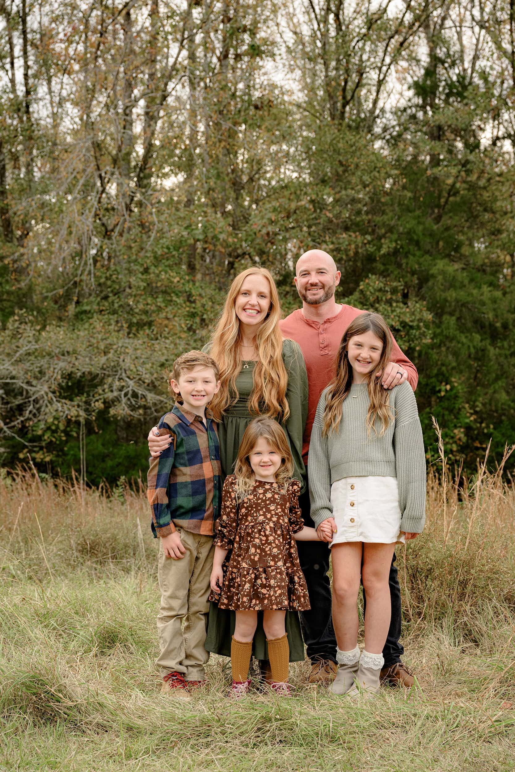 family of five dressed in fall tones to complement the peak fall colors found in charlotte area