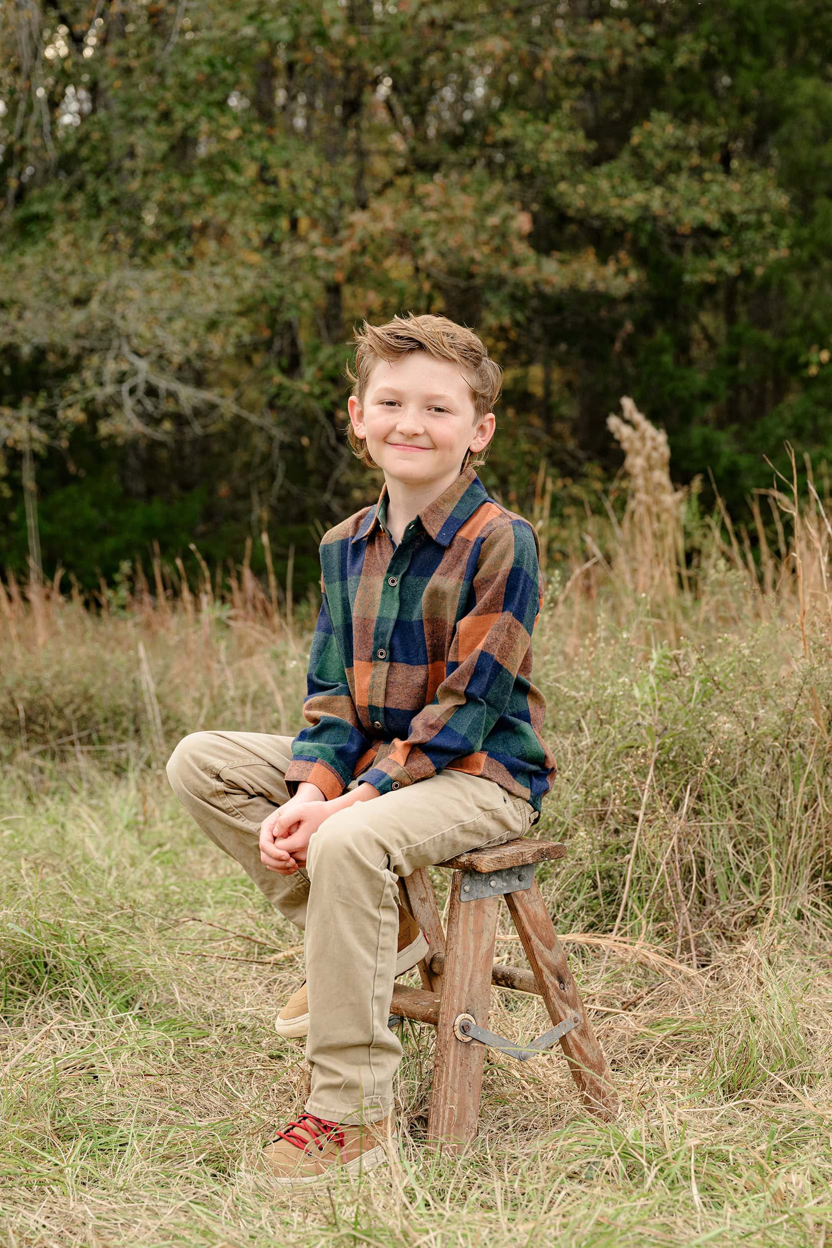 seasonal location with a waxhaw boy dressed in a plaid shirt and brown pants