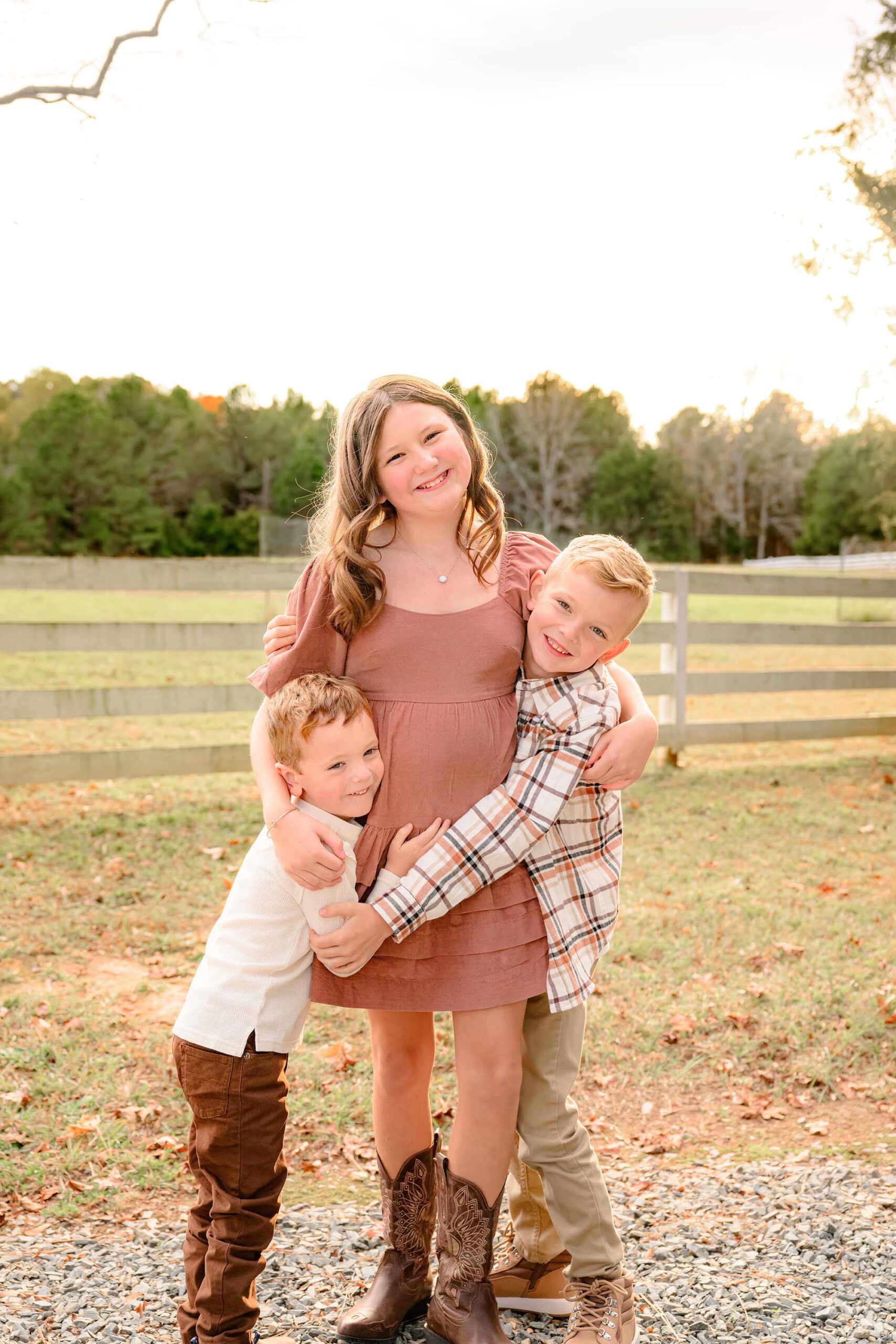 charlotte area siblings posed together in a big hug during their family photography session