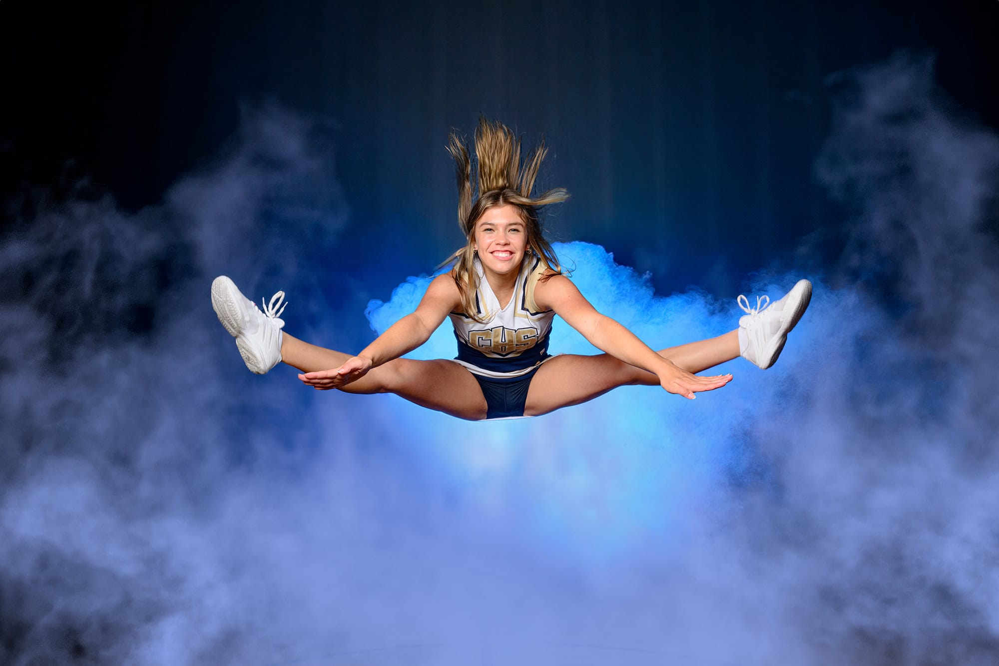 Charlotte athlete doing a toe touch while wearing her Cuthbertson High School uniform at media day