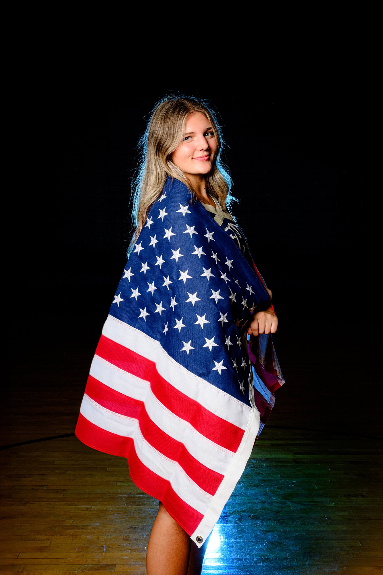 cuthbertson high school cheerleader showing her patriotism wrapped in an american flag