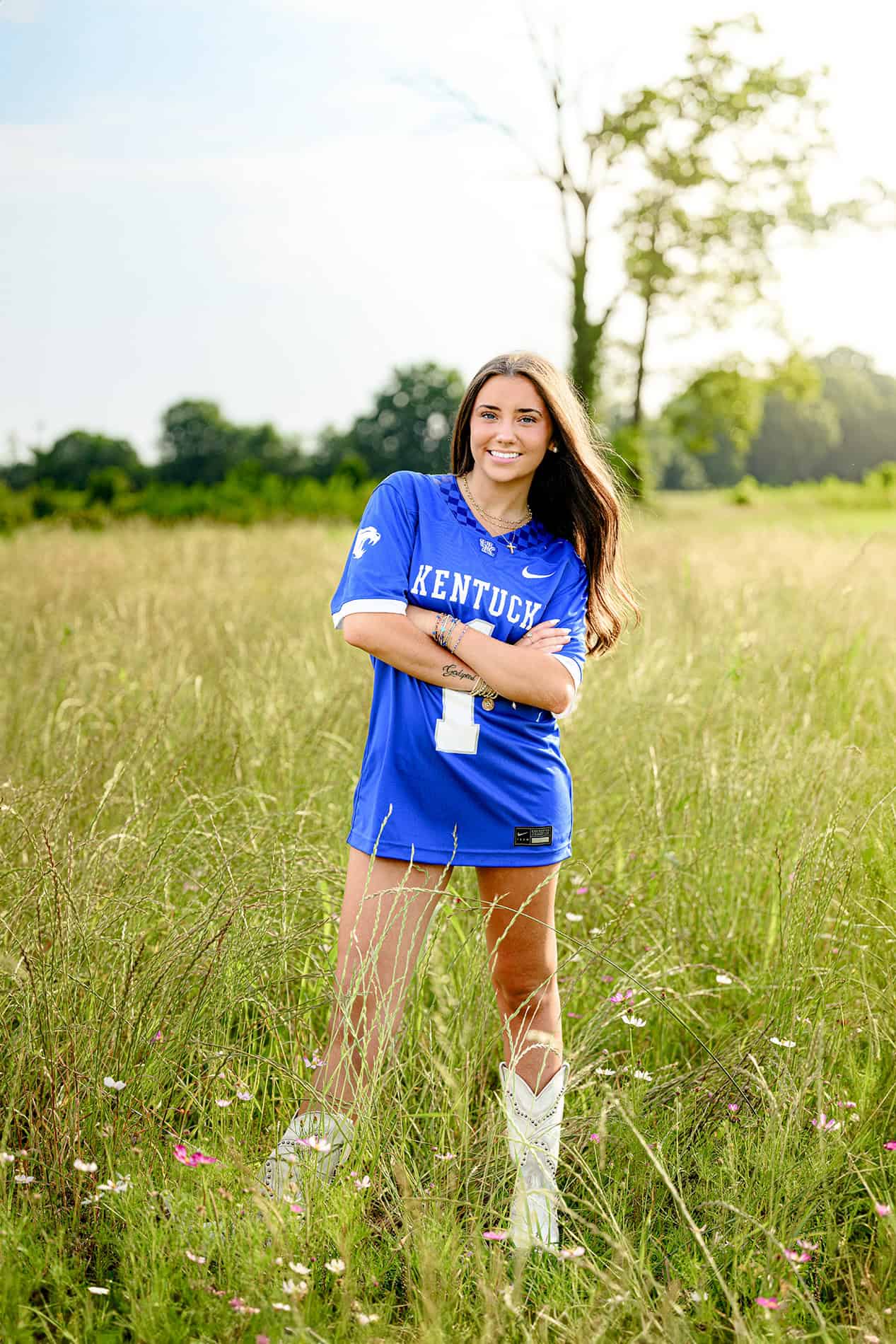 white boots and blue jersey stand out in senior portrait of university of kentucky future student