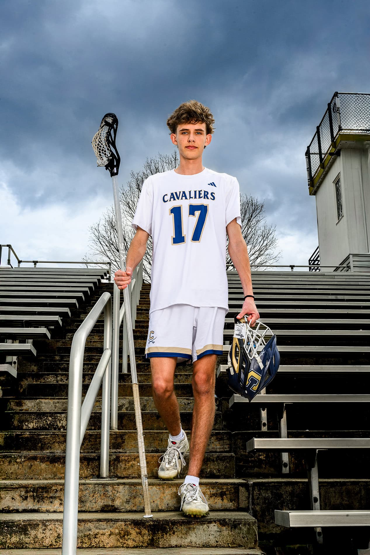 cuthbertson senior walking down steps of stadium holding his gear