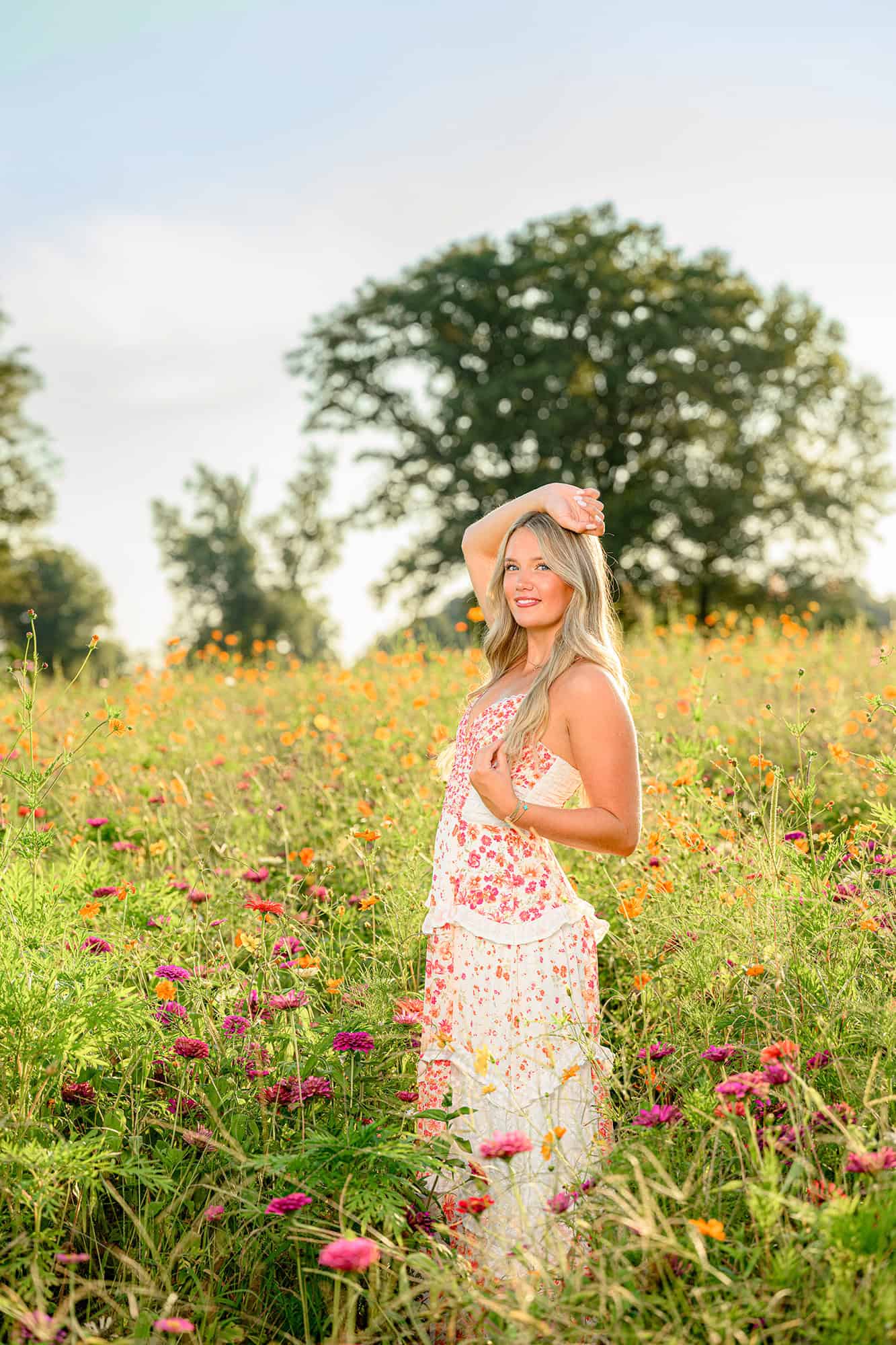 blonde high school graduate in a charlotte wildflower field