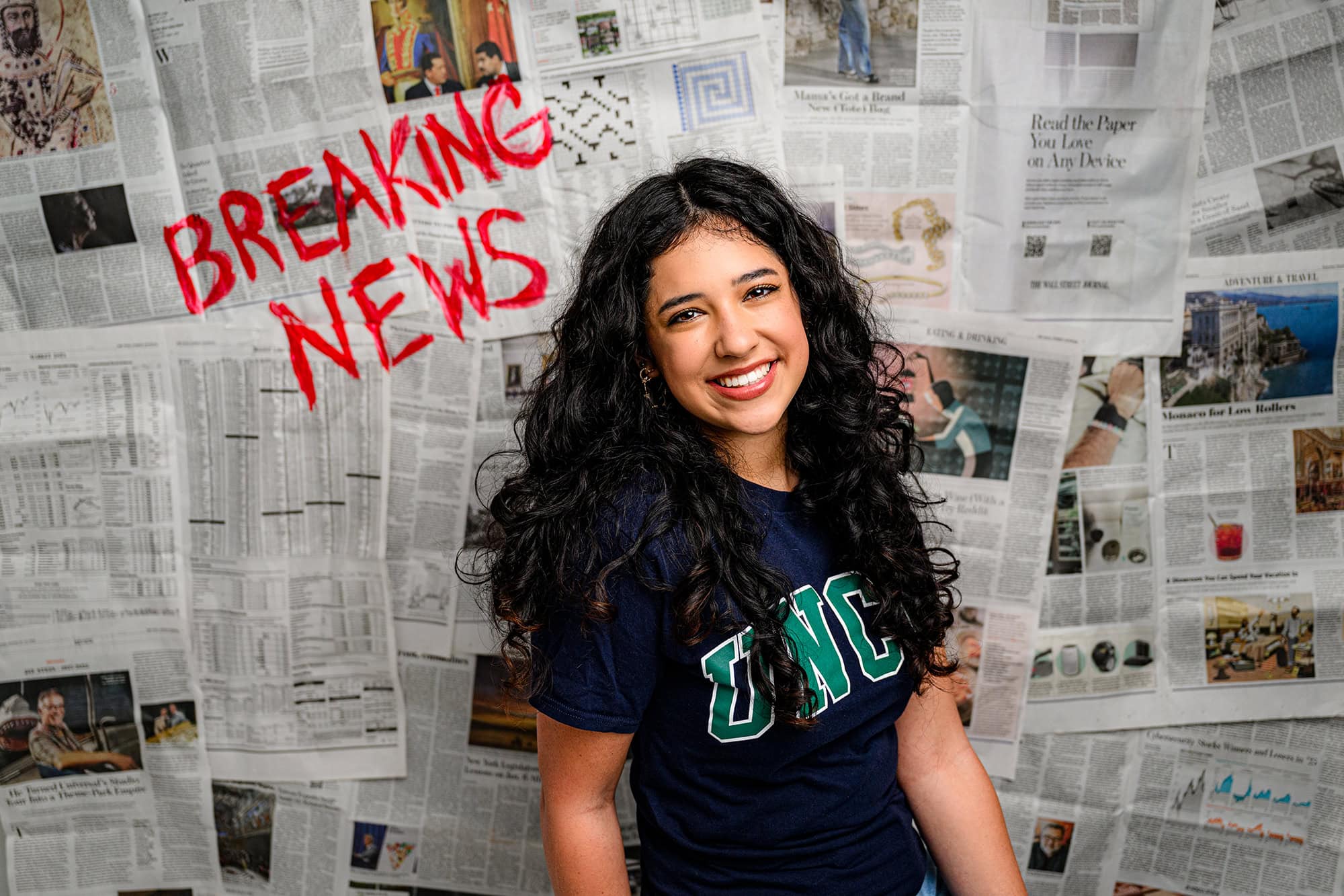 newspaper background with breaking news feature a future UNCW college student announcing her future college decision