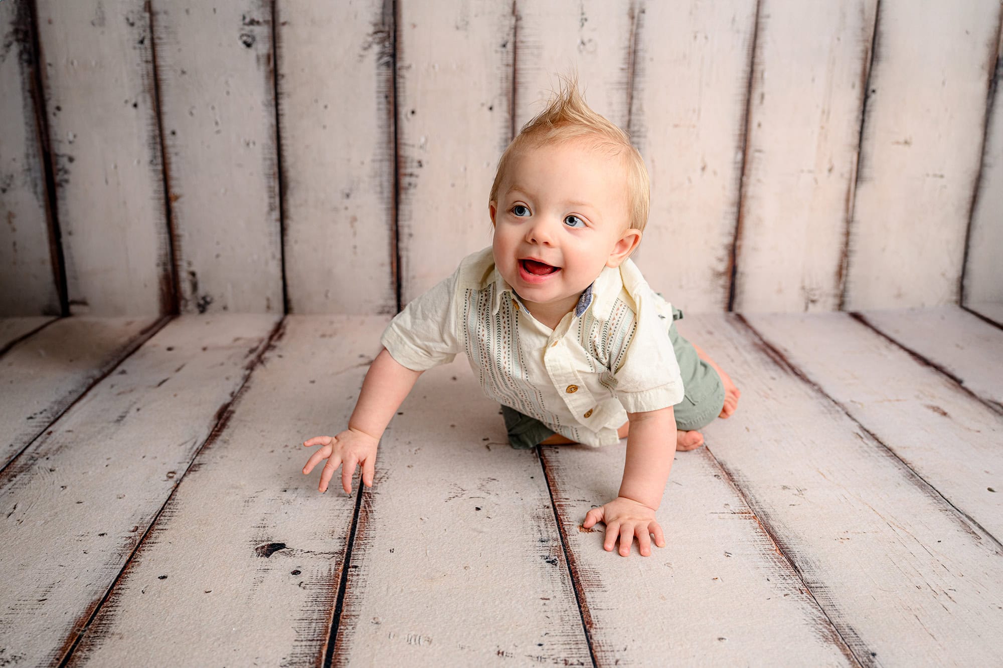 one year old preschool boy crawling
