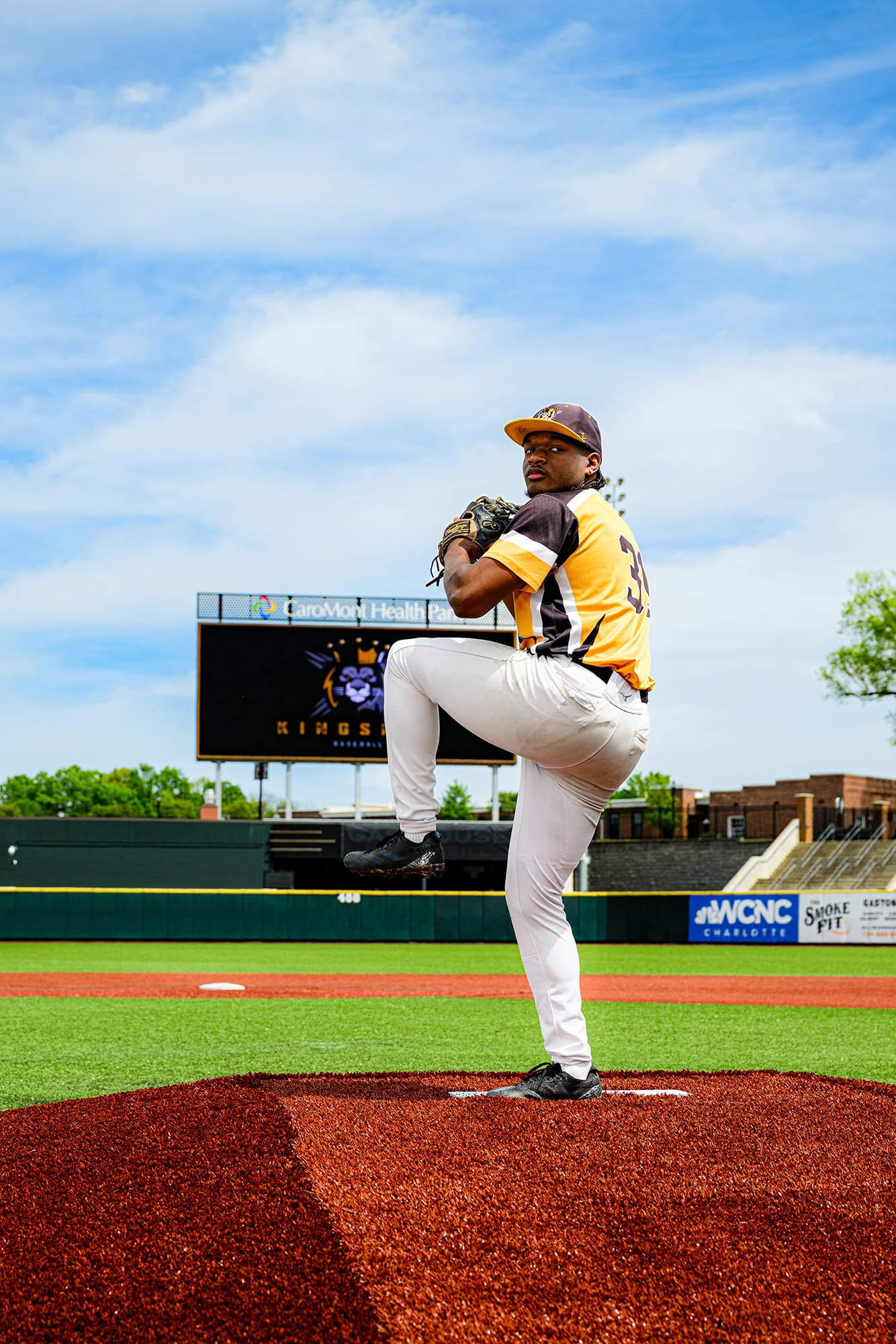 Kingsmen Academy Pitcher on the mound pulled back ready to throw for his senior portraits