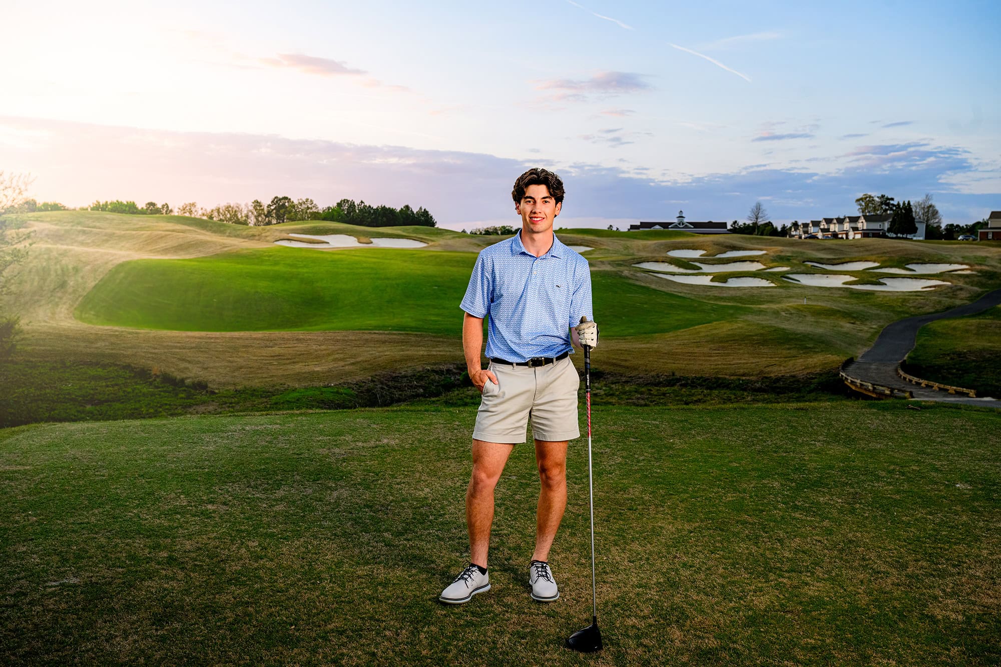 dark hair Charlotte grad capturing senior golf portraits