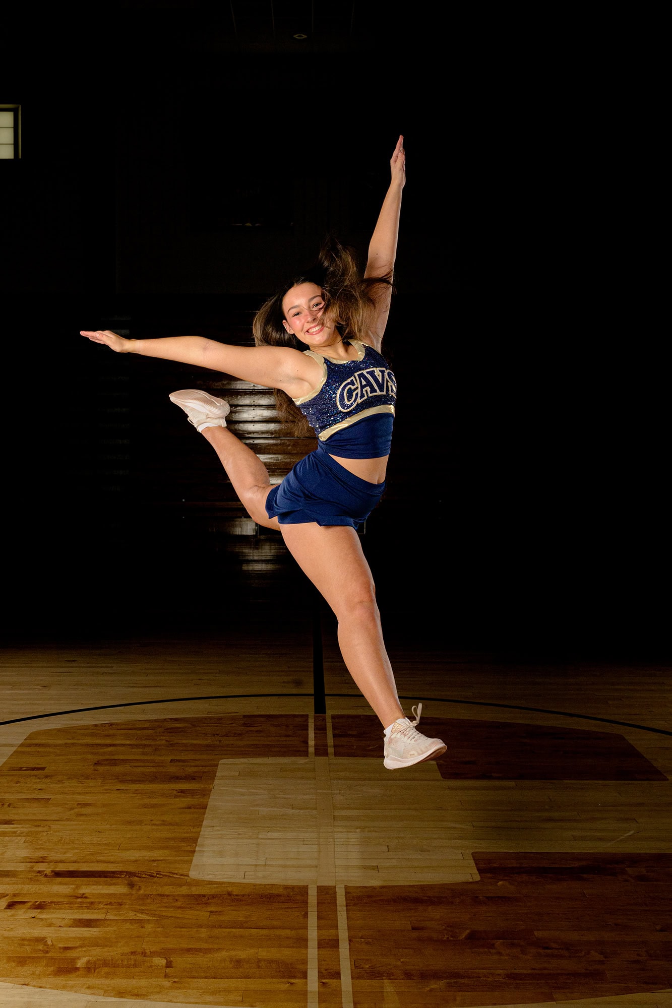 dancer in leap doing firebird for team dance media day session
