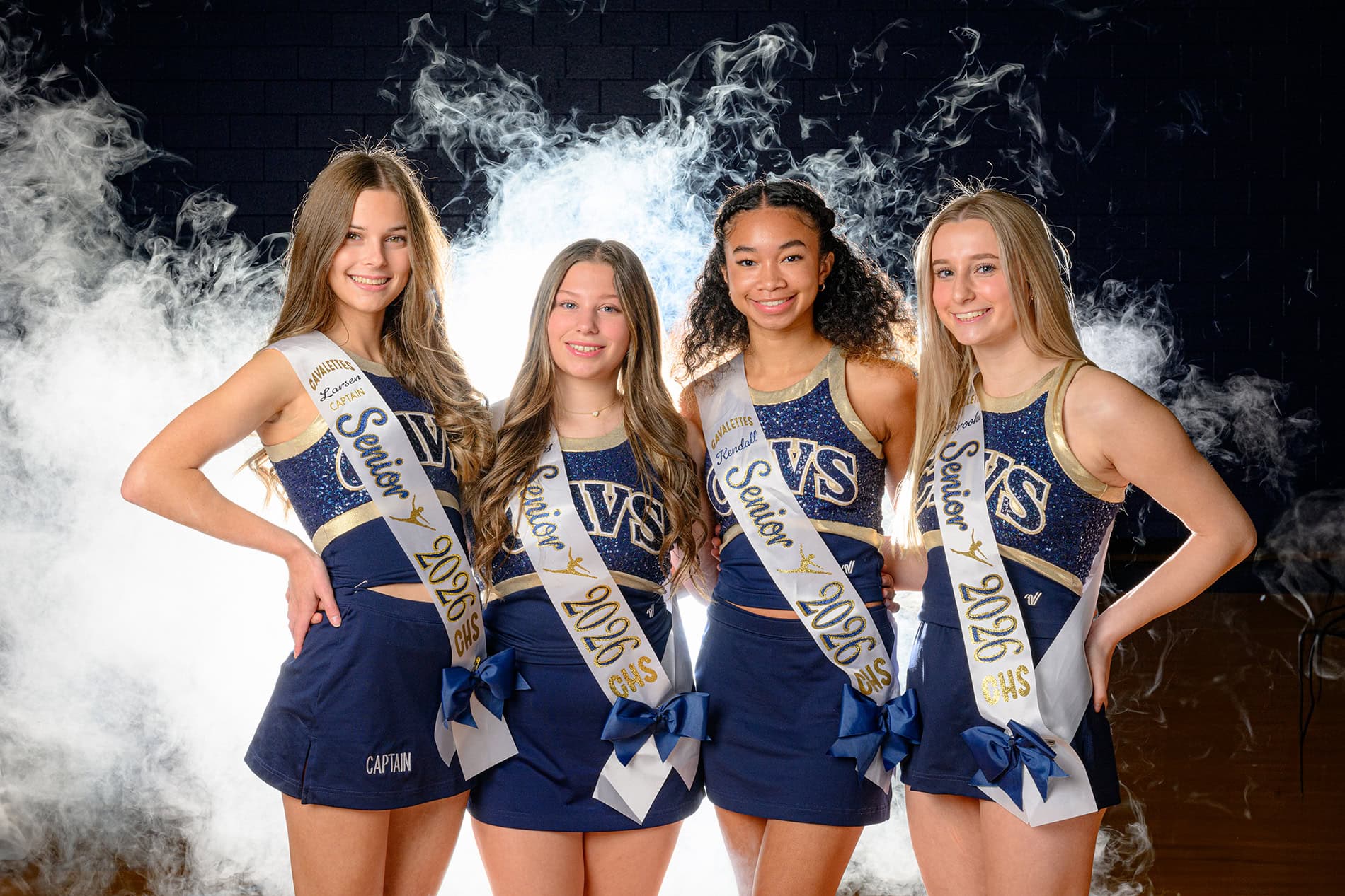 all four senior dancers with sashes on during team media day session