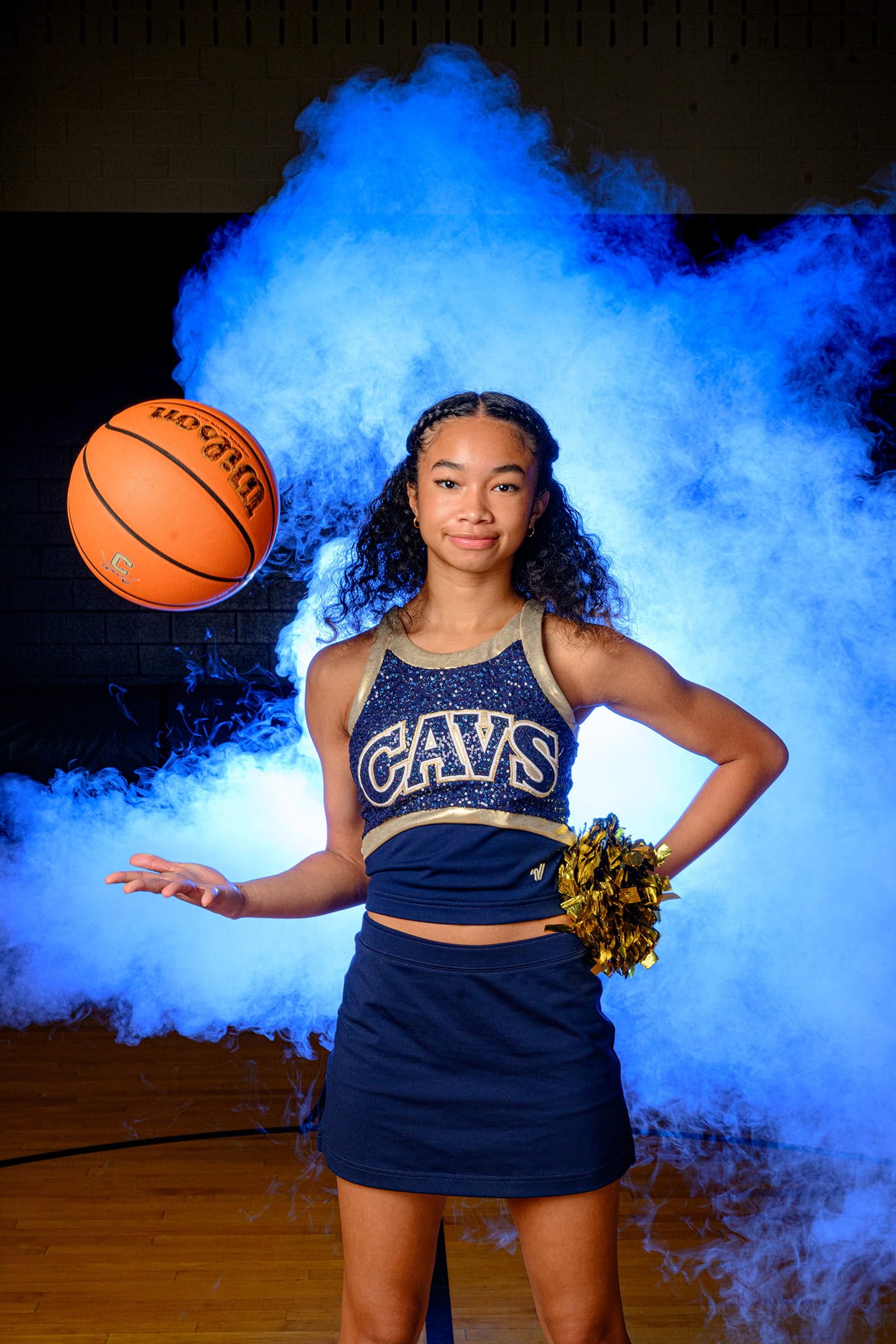 Dance Team Media day photo of dancer tossing basketball
