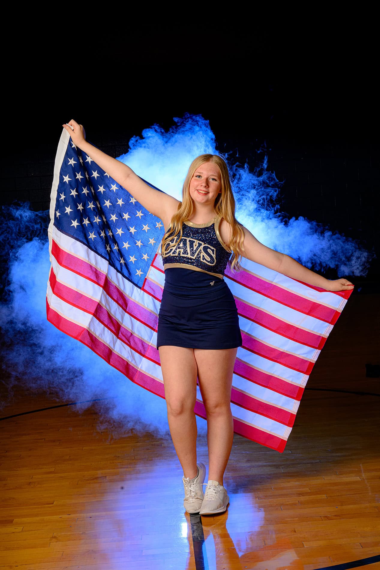 CHS Dance team media day photo of dancer holding USA flag