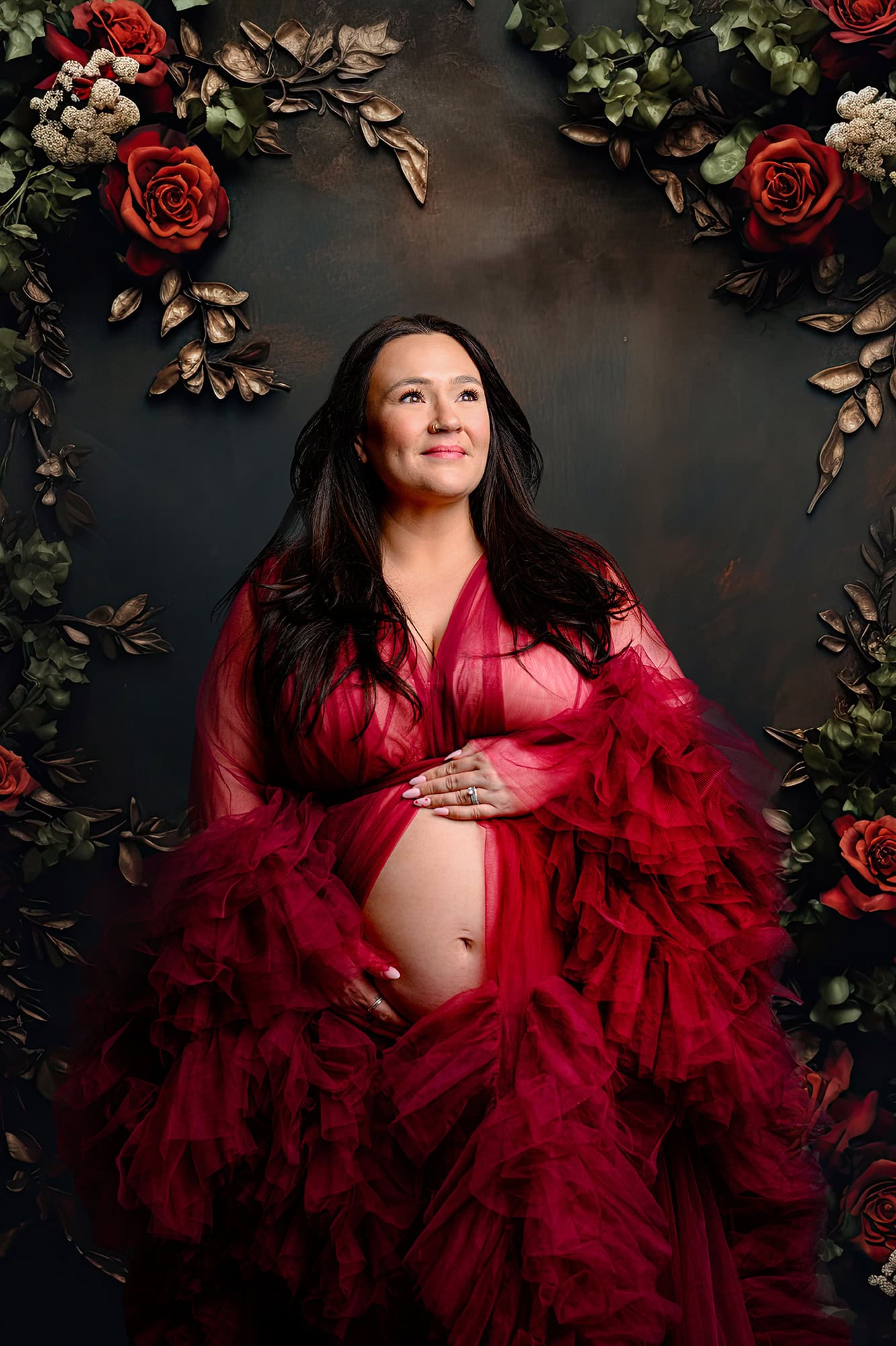 charlotte mom wearing a red maternity dress for her studio photos