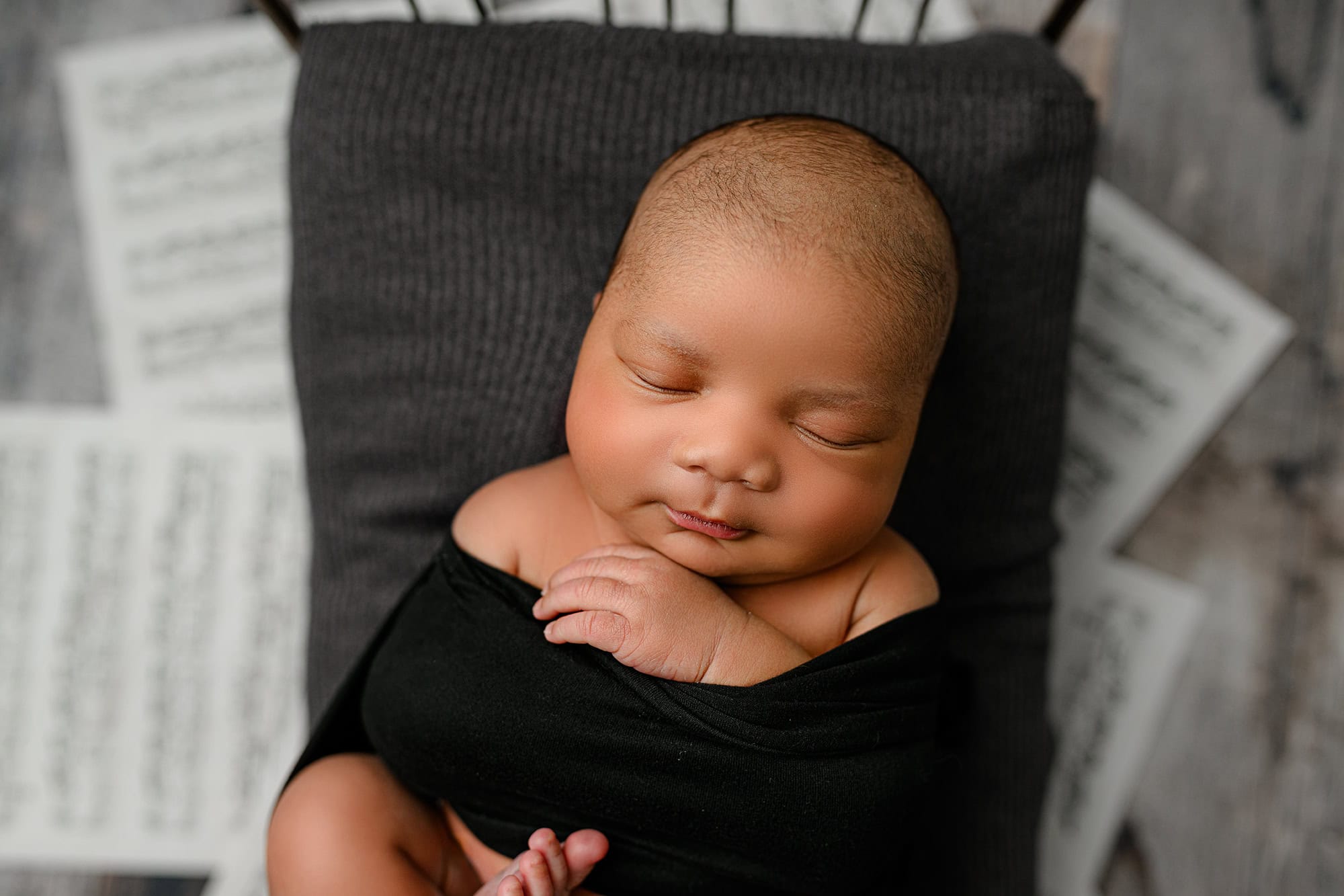 little newborn boy laying on a newborn bed